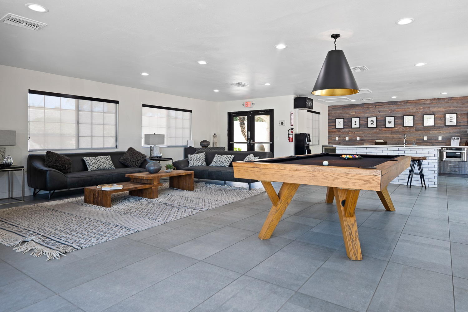 Member clubhouse with kitchen, pool table, and seating area