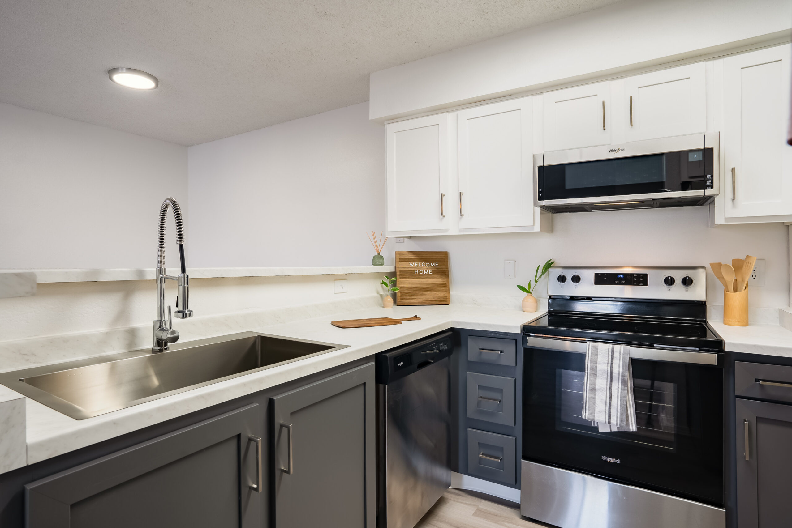 Apartment kitchen with dark blue cabinets