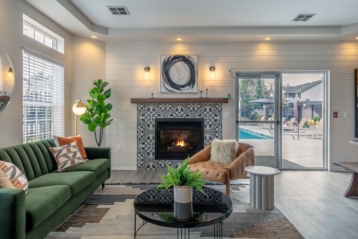 Member clubhouse seating area with couch and fireplace