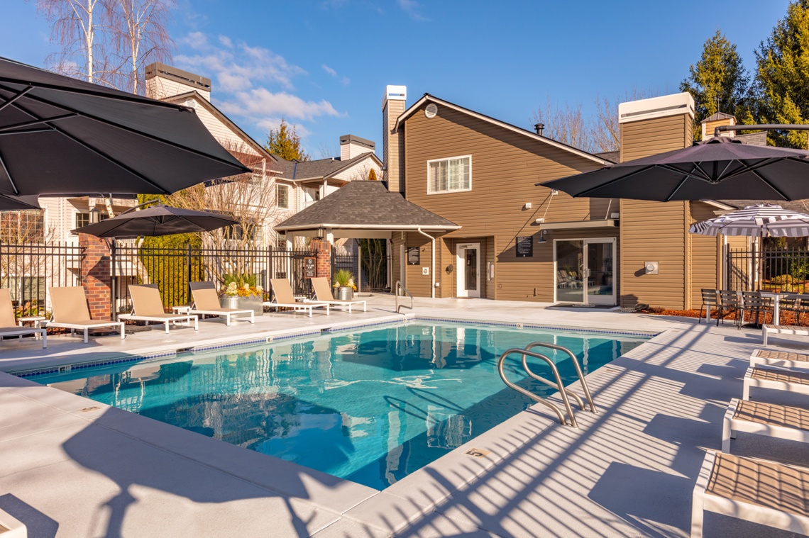 Outdoor pool and patio with lounge chair