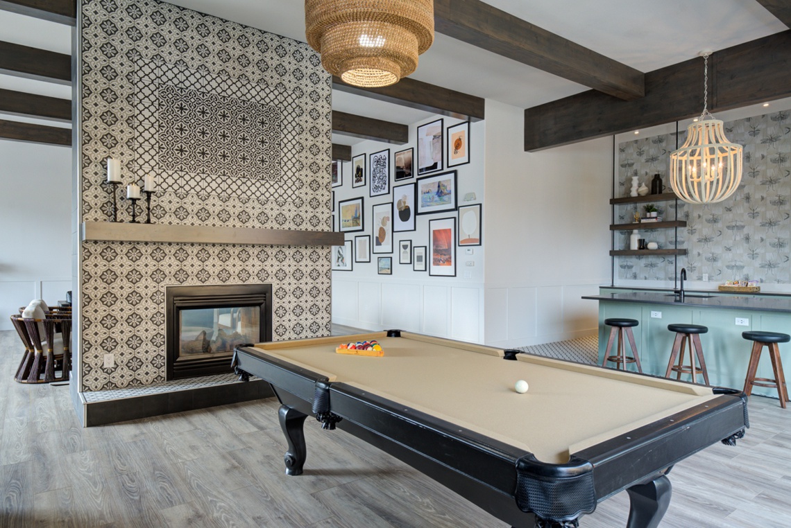 Member clubhouse interior with pool table and fireplace